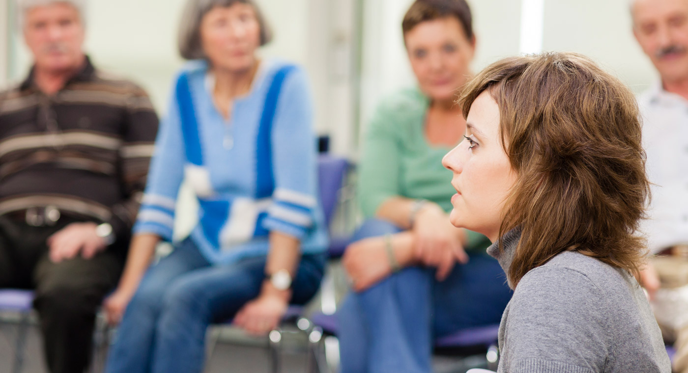 lady speaking to a group.