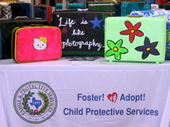 Port Neches-Groves High School students donated their suitcase art to foster children 