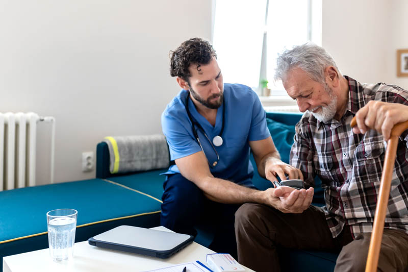 Medical provider checking pulse of a patient.