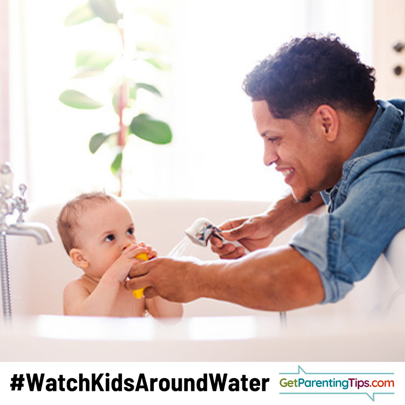 Dad with baby in bathtub. Text: #WatchKidsAroundWater GetParentingTips.com
