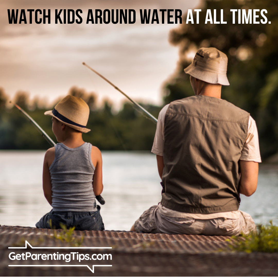 Father and son fishing on lake. Watch Kids around water at all times! GetParentingTips.com