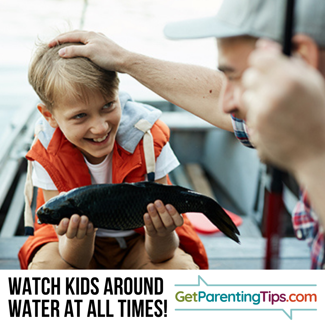 Father and son with fish on a boat. Watch Kids around water at all times! GetParentingTips.com