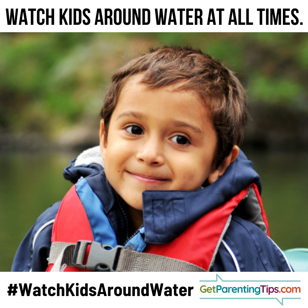 Smiling little boy in a life jacket. Watch Kids around water at all times! GetParentingTips.com #NationalWaterSafetyMonth
