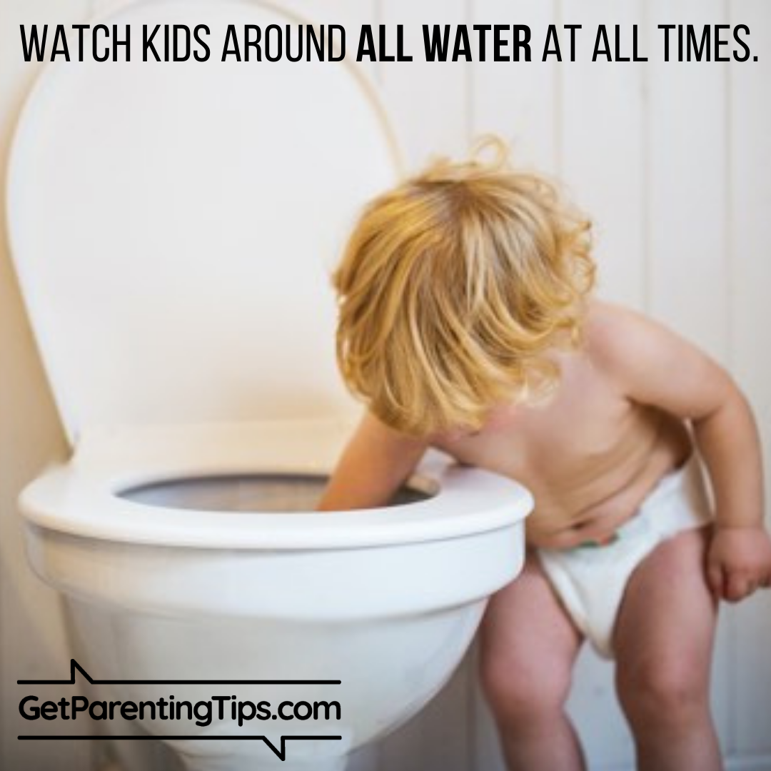 Toddler with one hand in a toilet bowl. Watch Kids around water at all times! GetParentingTips.com #NationalWaterSafetyMonth