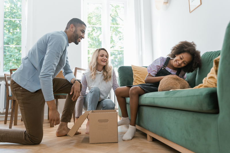 Family with pet interacting.