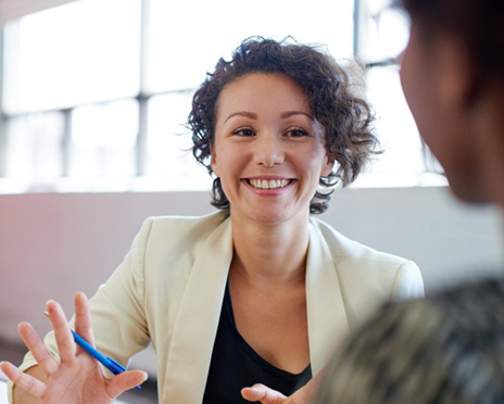 a lady talking to another person