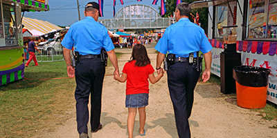 Law enforcement helping child during investigation 